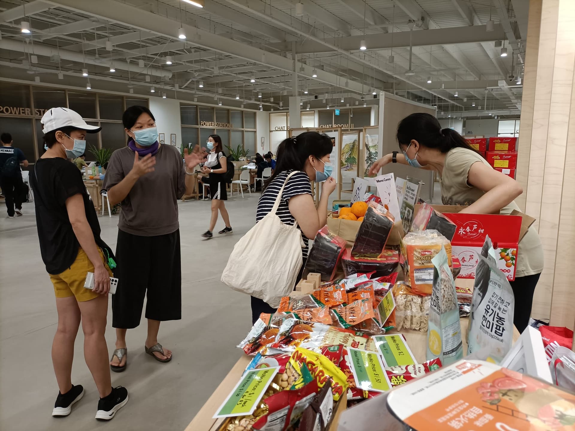 Volunteers explaining food items