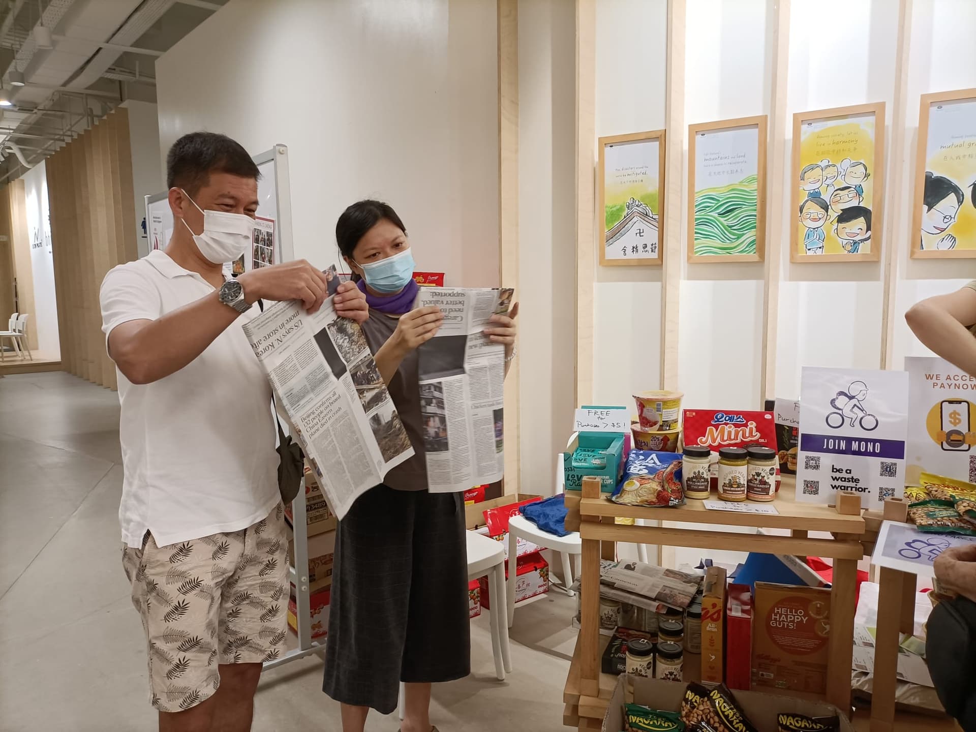 Folding a newspaper into a paper bag